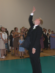 Chris tossing garter