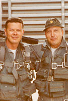 December 1969 Recruitment Poster; Lyn Sheldon and Gene Miller pose for a recruiting poster. Gene was a fellow navigator and a good friend. I'm hanging onto one of the two 20mm cannons. Above the cannons are four GE miniguns. All of the guns were capable of firing 6,000 rounds per minute.